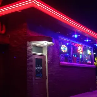 the neon lights on the outside of the building