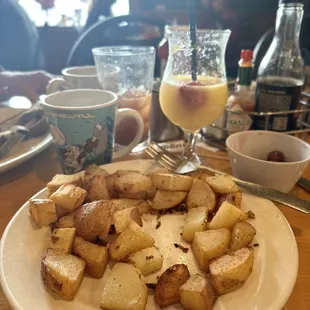 This is all I could order that was gluten free.  Yummy potatoes, fresh fruit and a mimosa.