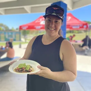 Nicole from Americas tire enjoying an asada taco JC&apos;s way