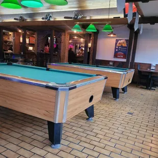 two pool tables in a restaurant