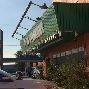 a car parked in front of a restaurant
