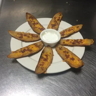 a plate of baked potato wedges