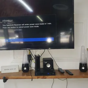 a flat screen tv and speakers