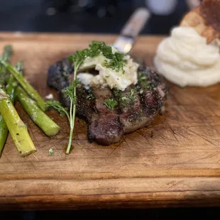12oz ribeye, mash potatoes, asparagus, garlic butter topping