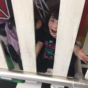 a young child in a cage