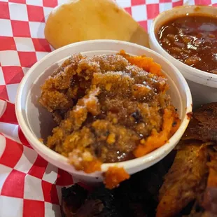 a basket of ribs and sides