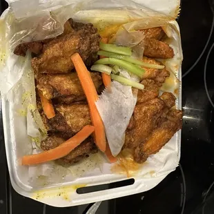 Lemon Pepper party wings on the left and Raging Buffalo party wings on the right!