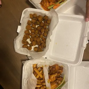 four takeout boxes of food