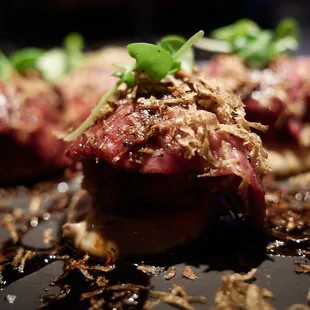 Japanese wagyu carpaccio w/ comte cheese fritter, truffle aioli, shaved truffles