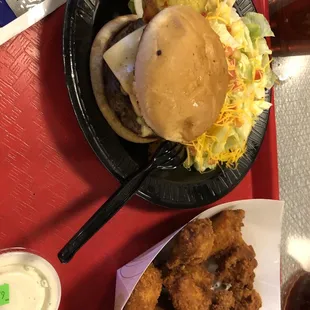 a hamburger and onion rings