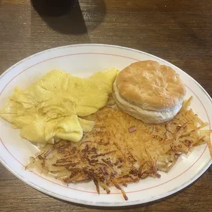 Scrambled eggs, hash browns and biscuit