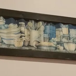Dirty dishes picture on the wall.