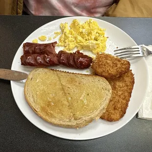 Spicy sausage, scrambled eggs, hash browns, and rye toast.