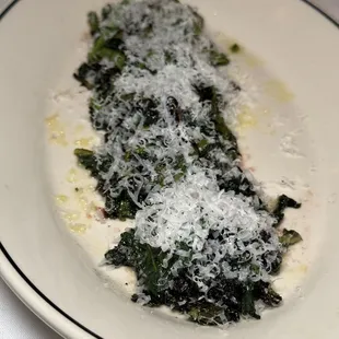 a plate of spinach and cheese