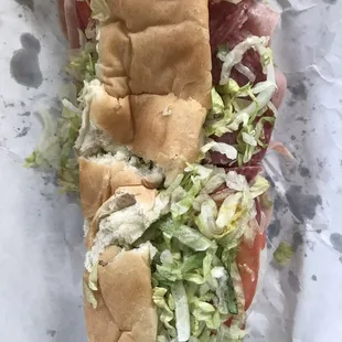a sub sandwich with lettuce and meat