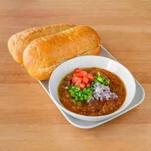 Ful 
(fava beans + ethiopian spices + tomato + green onion + red onion + jalapeno served with a roll of bread)