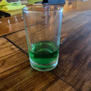 a green liquid in a glass