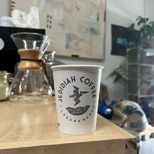 a cup of coffee on a table