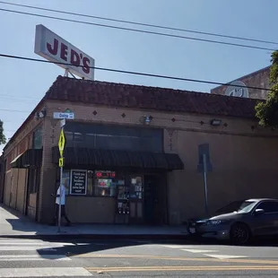 a car parked in front of the store