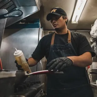 Loyal and faithfully dedicated chef and operator of the food truck, Devon Taitano. They are scamming Devon's family, their patrons