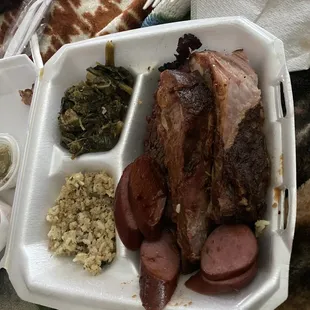 I got the three meat plate with sausage,ribs and brisket with a side of collard greens in dirty rice.