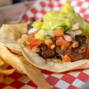 A fan favorite, our Arrachera Taco, skirt steak with pico de gallo and guacamole