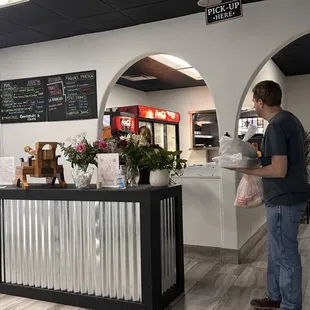 a man standing at the counter