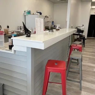 a bar with red stools