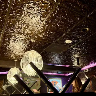 Beautiful tin ceiling and chandeliers downstairs.