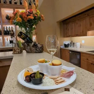 a plate of food and wine glasses