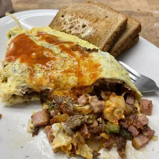 Al's omelette; full of veggies, cheese, &amp; three types of delicious porcine muscle.  You won't leave here hungry, or broke!