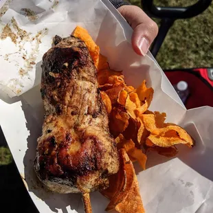 Grill chicken on a stick with sweet potatoes fries