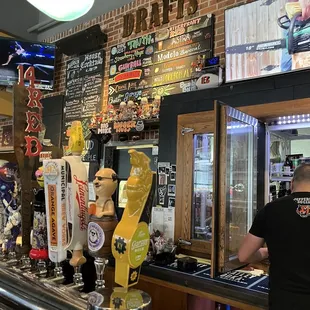 a man working behind a bar