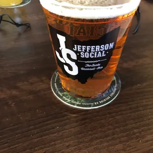 a glass of beer on a table