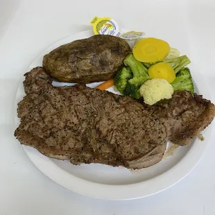 Grilled to order 12 oz NY strip with baked potato and mixed vegetables - only $18.99!  Best prices. Best food.  Period!