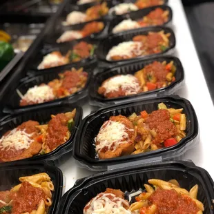 a table of pasta and meatballs