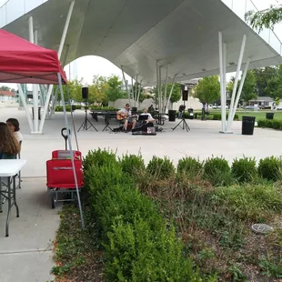 people sitting under a tent
