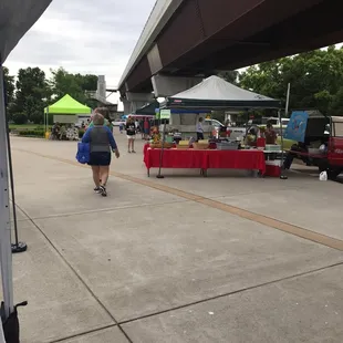 a woman walking down the sidewalk