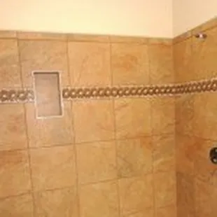 a bathroom with a toilet and shower