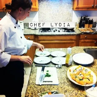 Chef Lydia preparing an amazing meal for us in my kitchen.