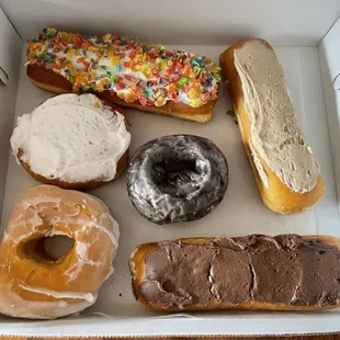Fruity pebbles, maple long John, raspberry filled, chocolate cake donut, glazed, reg long John