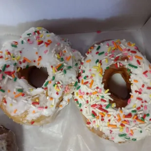 Glazed doughnuts with sprinkles.
