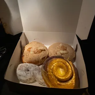 Cinnamon roll, powdered donut and apple cinnamon donuts