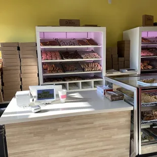 a counter with a variety of donuts