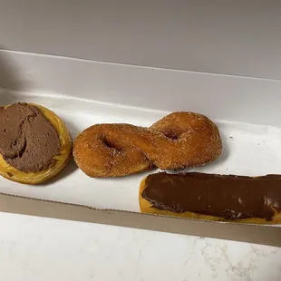 custard, cinnamon twist and long john donuts