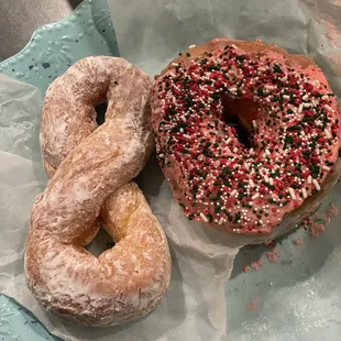 Twisted powder donut and donut with sprinkles
