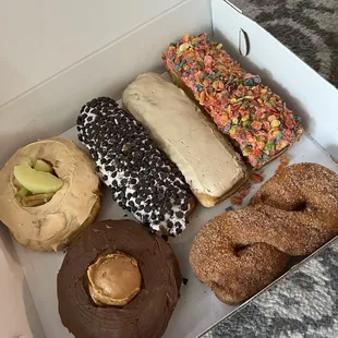 Donuts (top to the right): Caramel apple, choc chip, maple long John, fruity pebbles, chocolate peanut butter, cinnamon twist