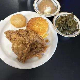 Fried chicken with mashed potatoes and turnip greens