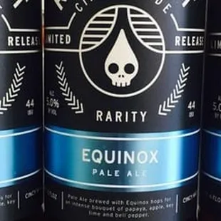 three cans of equinox pale ale
