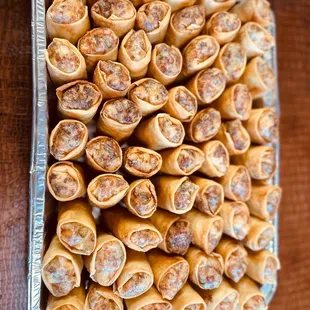 a tray of sausage rolls